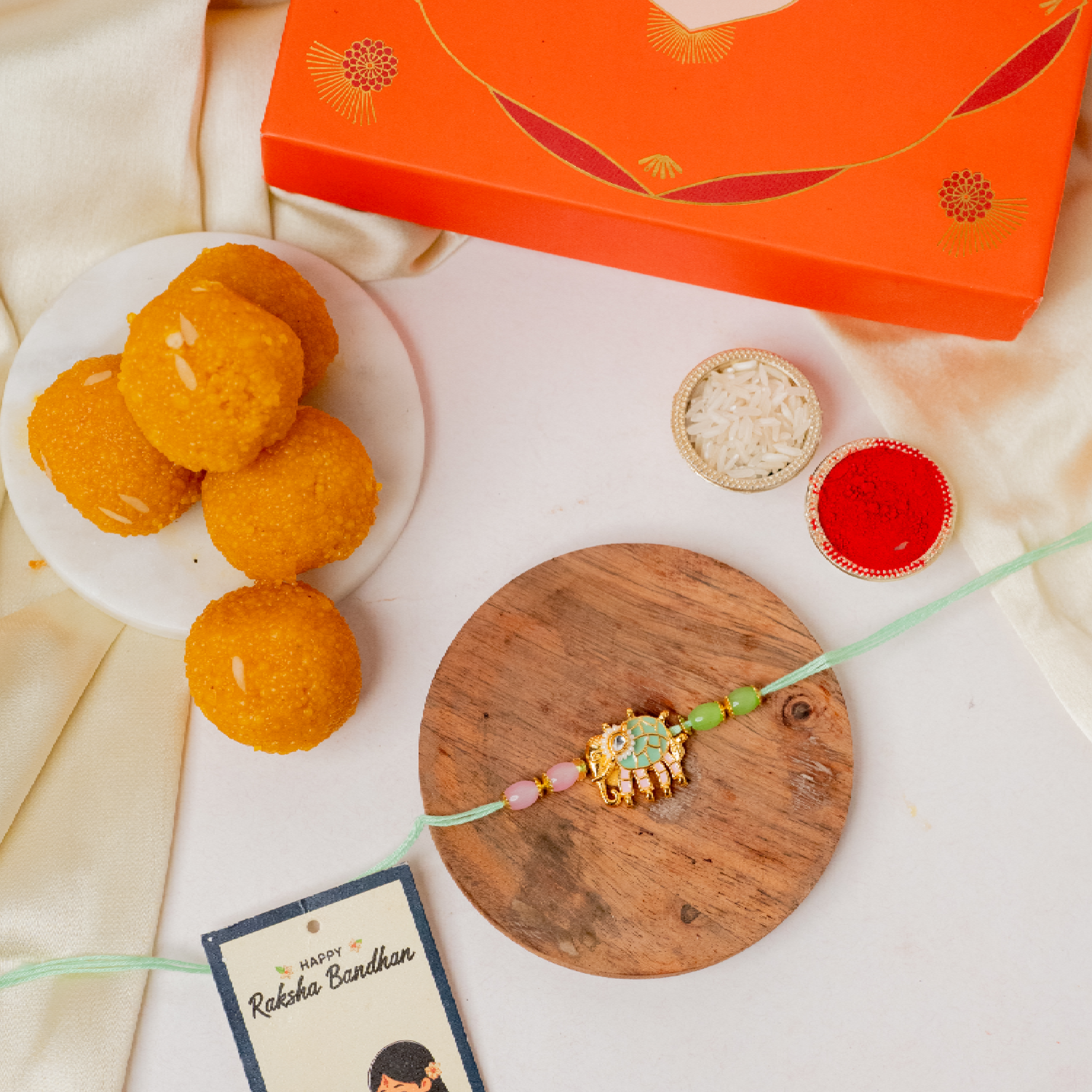 Pastel Elephant Rakhi & Ladoo Pastel Elephant Rakhi & Ladoo
