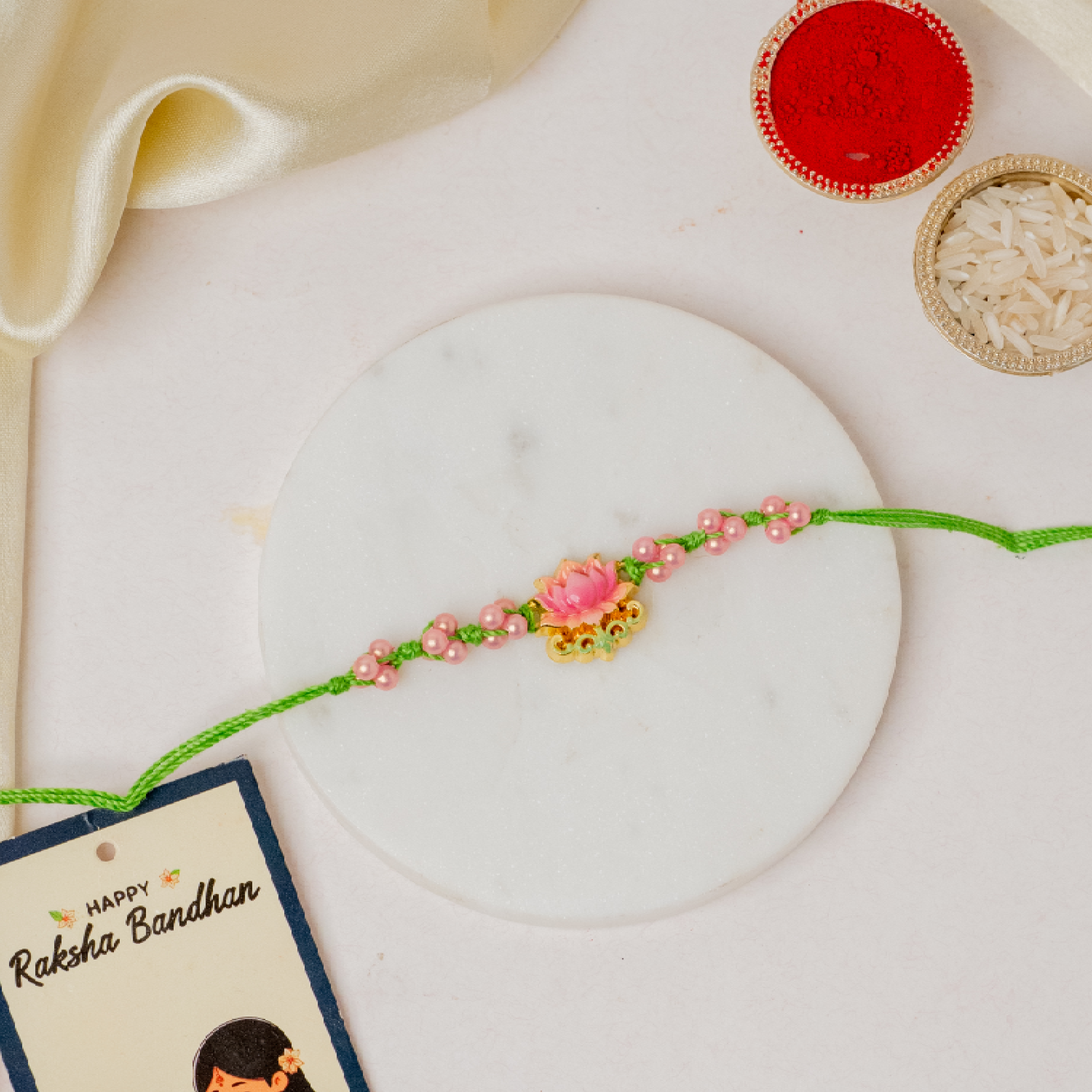 Lotus Rakhi & Pastel Thaali Lotus Rakhi & Pastel Thaali