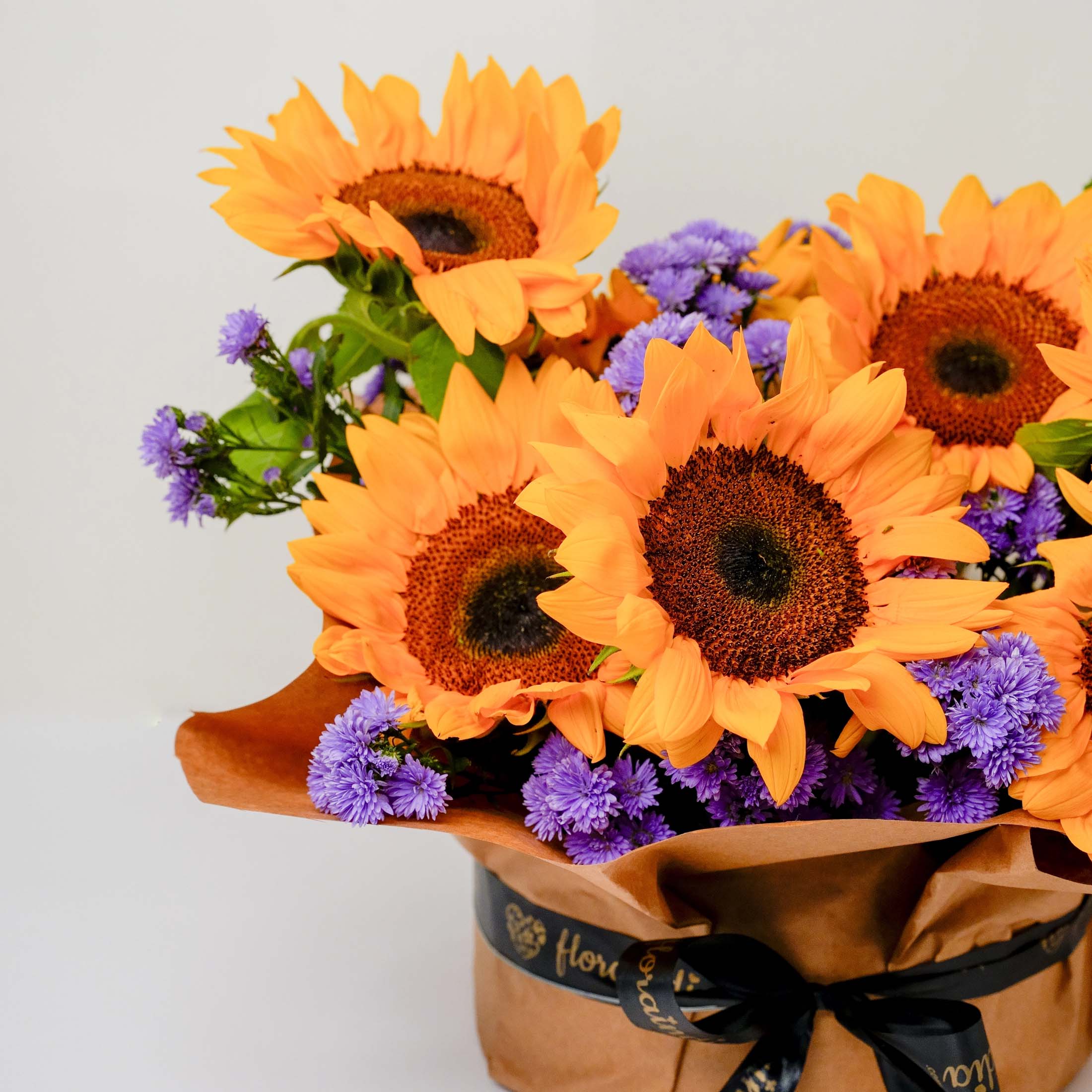 Sunflowers and Blue Daisies in Vase