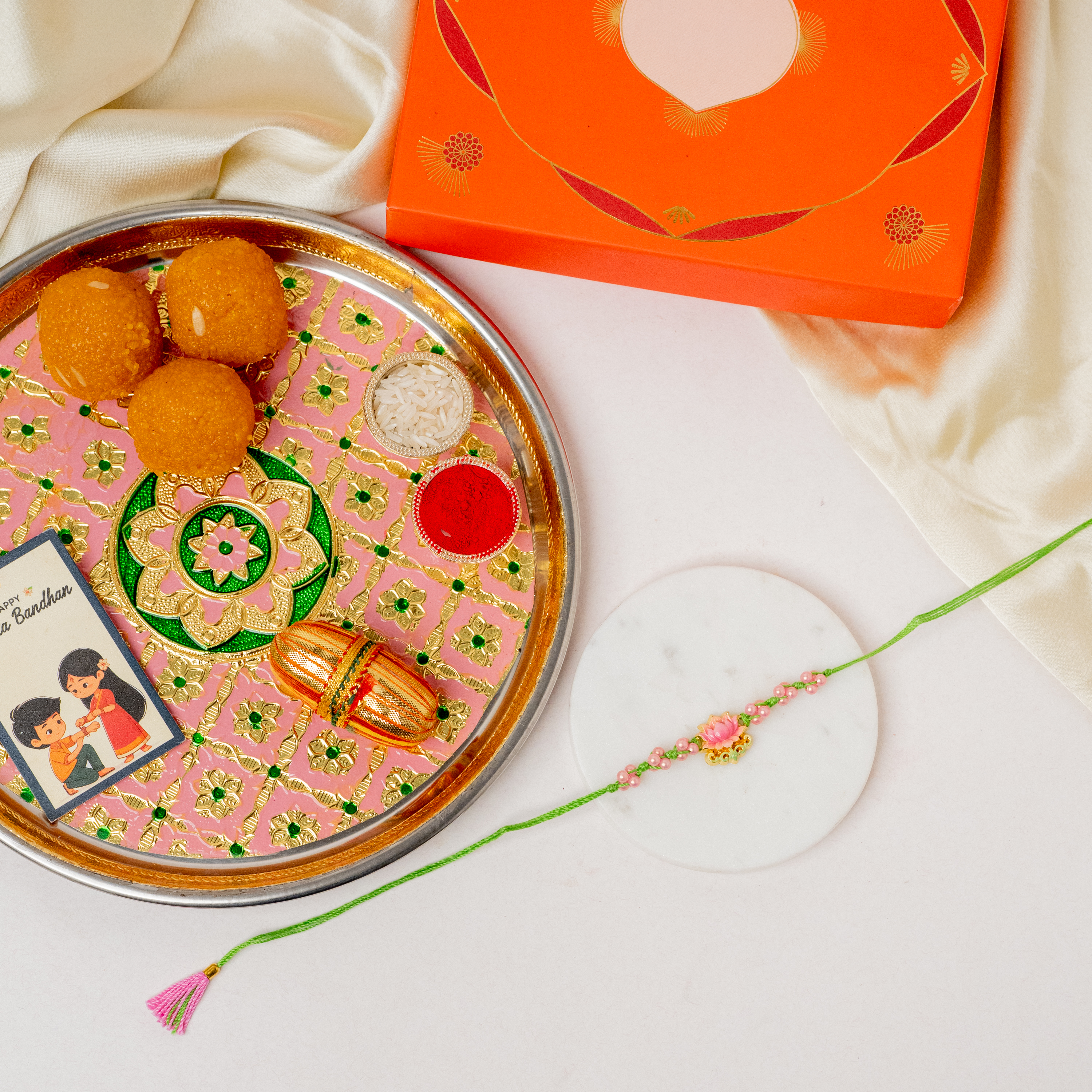 Lotus Rakhi & Pastel Thaali Lotus Rakhi & Pastel Thaali
