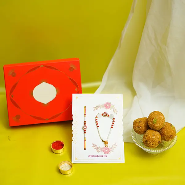 Om Studded Rakhi with Pearl Lumba & Sweets