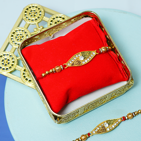 Stone Studded Metal Rakhi with Cashews